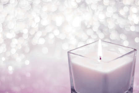 Festive decoration, branding and aromatherapy spa concept - Blush pink aromatic candle on Christmas and New Years glitter background, Valentines Day luxury home decor and holiday season brand designの写真素材