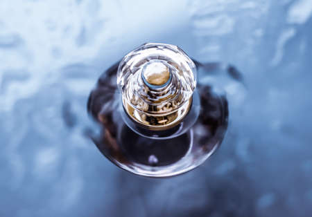 Perfumery, cosmetics and branding concept - Perfume bottle under blue water, fresh sea coastal scent as glamour fragrance and eau de parfum product as holiday gift, luxury beauty spa brand presentの写真素材