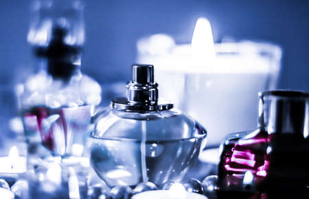 Perfumery, cosmetics branding and luxe concept - Perfume bottle and vintage fragrance on glamour vanity table at night, pearls jewellery and eau de parfum as holiday gift, luxury beauty brand presentの写真素材