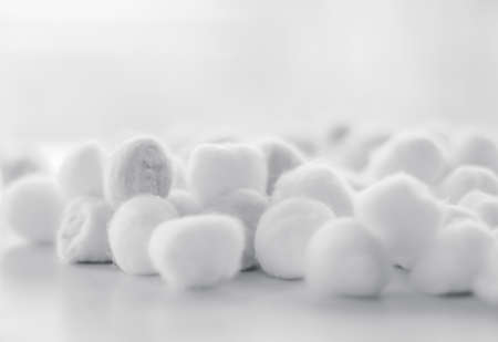 Cosmetology, branding and cleanliness concept - Organic cotton balls background for morning routine,...