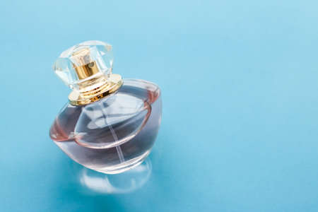 Perfumery, spa and branding concept - Pink perfume bottle on glossy background, sweet floral scent,...