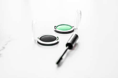 Cosmetic branding, blog and girly concept - Eyeshadows, black liner and mascara on marble background, eye shadows cosmetics as glamour make-up products for luxury beauty brand, holiday flatlay designの写真素材