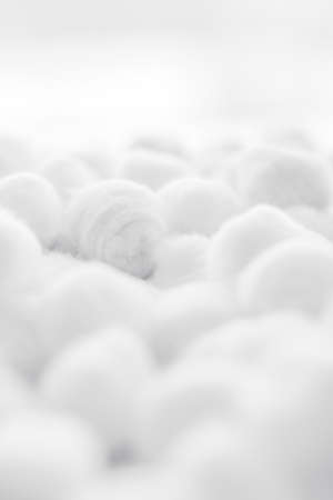 Cosmetology, branding and cleanliness concept - Organic cotton balls background for morning routine, spa cosmetics, hygiene and natural skincare beauty brand product as healthcare and medical designの写真素材