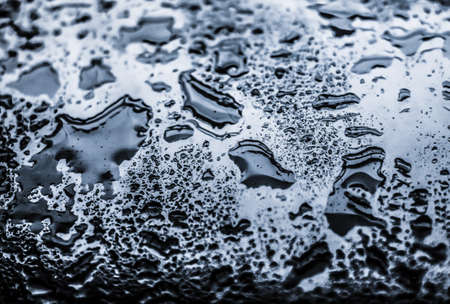 Liquid, wet and zen concept - Water texture abstract background, aqua drops on silver glass as...