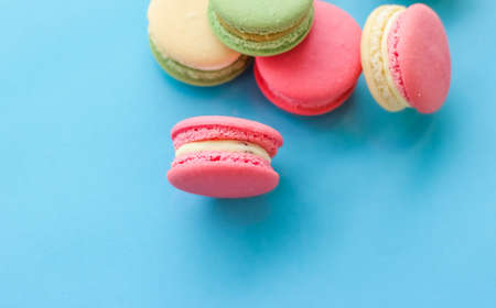 Pastry, bakery and branding concept - French macaroons on blue background, parisian chic cafe dessert, sweet food and cake macaron for luxury confectionery brand, holiday backdrop designの写真素材