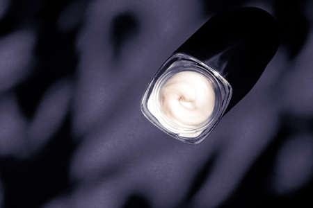 Anti-age moisturizer, luxe cosmetics and organic science concept - Moisturizing beauty face cream for sensitive skin, luxury spa cosmetic and natural clean skincare product on purple backgroundの写真素材