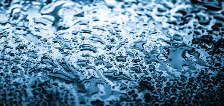 Liquid, wet and zen concept - Water texture abstract background, aqua drops on blue glass as science...
