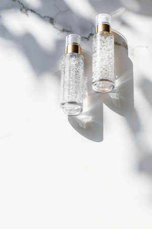 Cosmetic branding, packaging and make-up concept - Skin care serum and gel bottle, moisturizing...