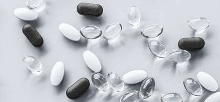 Pharma, branding and lab concept - Pills and capsules for diet nutrition, anti-aging beauty supplements, probiotic drugs, pill vitamins as medicine and healthcare cosmetics, pharmacy brand backgroundの写真素材