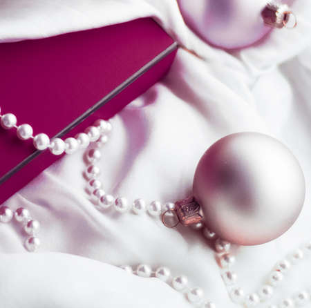 Holidays branding, happy giving and decoration concept - Christmas holiday background, festive baubles and purple vintage gift box as winter season present for luxury brand designの写真素材