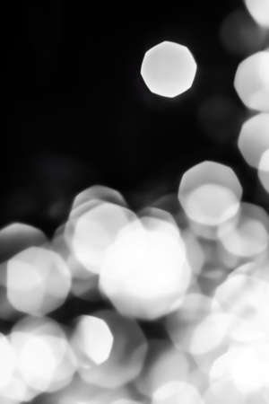 Holiday branding, glam and glow concept - Glamorous white shiny glitter on black abstract background, Christmas, New Years and Valentines Day backdrop, bokeh overlay for luxury holidays brand designの写真素材