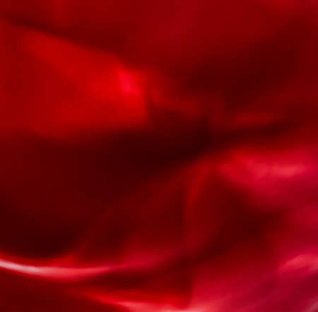 Holiday branding, beauty glamour and love backgrounds concept - Red abstract art background, silk texture and wave lines in motion for classic luxury designの写真素材