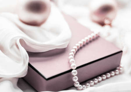 Holidays branding, happy giving and decoration concept - Christmas holiday background, festive baubles and blush pink vintage gift box as winter season present for luxury brand designの写真素材