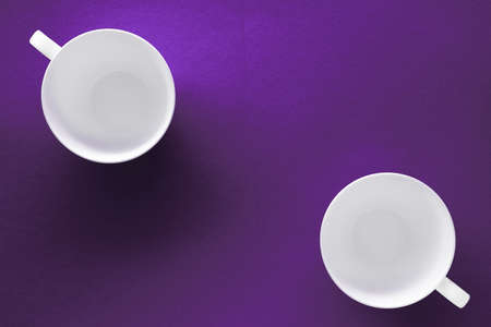 Kitchen, table decor and drinks menu concept - White tableware crockery set, empty cup on purple flatlay backgroundの写真素材