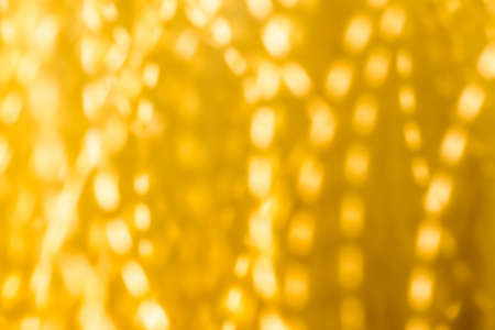 Golden Christmas lights, New Years Eve fireworks and abstract texture concept - Glamorous gold shiny glow and glitter, luxury holiday backgroundの写真素材