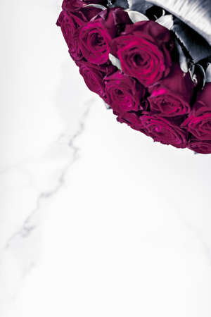 Gift for her, romantic relationship and floral design concept - Luxury bouquet of maroon roses on marble background, beautiful flowers as holiday love present on Valentines Dayの写真素材