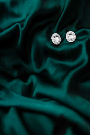 Jewellery brand, elegant fashion and bridal luxe gift concept - Luxury diamond earrings on dark...