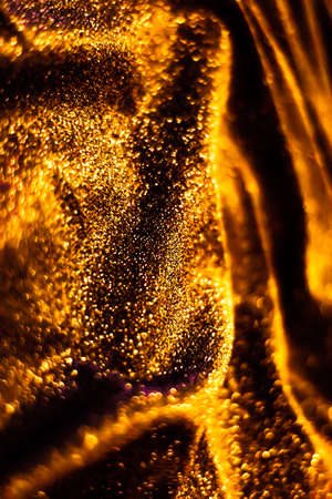 Luxe glowing texture, night club branding and New Years party concept - Bronze holiday sparkling glitter abstract background, luxury shiny fabric material for glamour design and festive invitationの写真素材