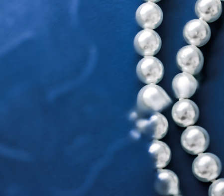 Jewelry, branding and gems concept - Coastal jewellery fashion, pearl necklace under blue water background, glamour style present and chic gift for luxury jewelery brand, holiday banner designの写真素材