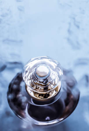 Perfumery, cosmetics and branding concept - Perfume bottle under blue water, fresh sea coastal scent as glamour fragrance and eau de parfum product as holiday gift, luxury beauty spa brand presentの写真素材