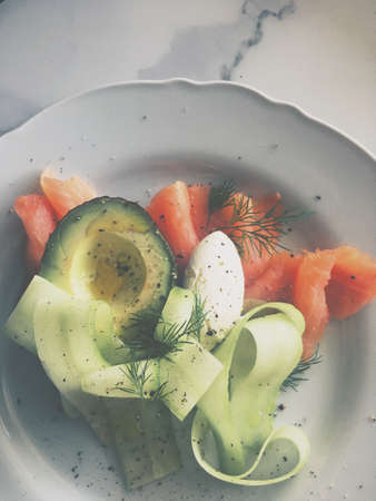 Lunch, restaurant and diet concept - Fresh salmon salad with avocado and creamy mascarpone cheese...
