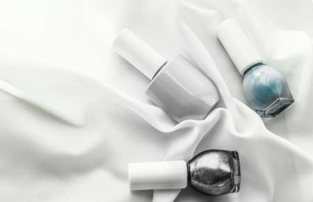 Cosmetic branding, salon and glamour concept - Nail polish bottles on silk background, french manicure products and nailpolish make-up cosmetics for luxury beauty brand and holiday flatlay art designの写真素材