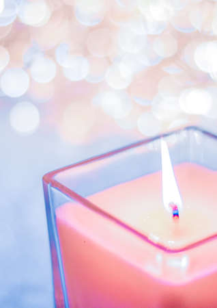 Festive decoration, branding and aromatherapy spa concept - Coral aromatic candle on Christmas and New Years glitter background, Valentines Day luxury home decor and holiday season brand designの写真素材