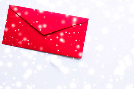 Greetings, postal service and online newsletter concept - Winter holiday blank paper envelopes on marble with shiny snow flatlay background, love letter or Christmas mail card designの写真素材