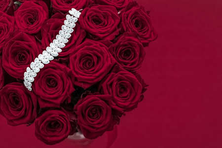 Luxe branding, glamour fashion and boutique shopping concept - Luxury diamond jewelry bracelet and red roses flowers, love gift on Valentines Day and jewellery brand holiday background designの写真素材