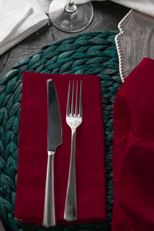 Table scape, menu and interior concept - Holiday table setting with red napkin and silver cutlery, food styling props, vintage set for wedding, event, date, party or luxury home decor brand designの写真素材
