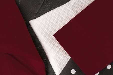 Tableware, material or cloth concept - Kitchen textile on black rustic wooden background, napkin and towel set, folded fabrics as food styling props for luxury home decor brand, interior designの写真素材