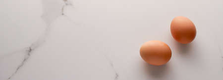Ingredient, branding and diet concept - Egg on marble table as minimalistic food flat lay, top view food brand photography flatlay and recipe inspiration for cooking blog, menu or cookbook designの写真素材