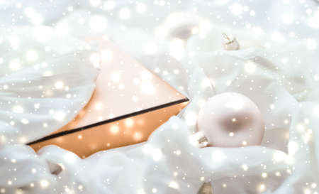 Holidays branding, glamour and decoration concept - Christmas magic holiday background, festive baubles, yellow vintage gift box and golden glitter as winter season present for luxury brand designの写真素材