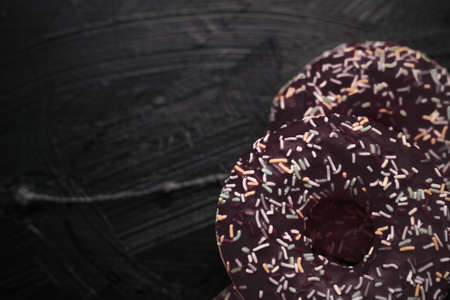 Bakery, branding and cafe concept - Frosted sprinkled donuts, sweet pastry dessert on rustic wooden background, doughnuts as tasty snack, top view food brand flat lay for blog, menu or cookbook designの写真素材