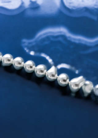 Jewelry, branding and gems concept - Coastal jewellery fashion, pearl necklace under blue water background, glamour style present and chic gift for luxury jewelery brand, holiday banner designの写真素材