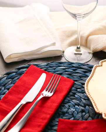 Table scape, menu and interior concept - Holiday table setting with red napkin and silver cutlery, food styling props, vintage set for wedding, event, date, party or luxury home decor brand designの写真素材