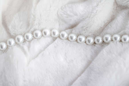 Jewelry branding, elegance and sale concept - Winter holiday jewellery fashion, pearl necklace on fur background, glamour style present and chic gift for luxury jewelery brand shopping, banner designの写真素材