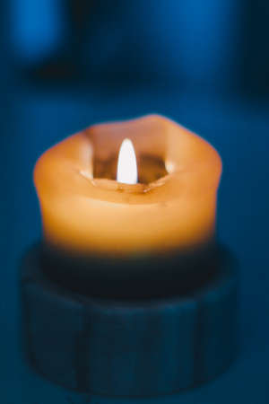 Happy holidays, greeting card backdrop and winter season concept - Yellow holiday candle on blue background, luxury branding design and decoration for Christmas, New Years Eve and Valentines Dayの写真素材