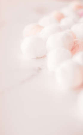 Cosmetology, branding and cleanliness concept - Organic cotton balls background for morning routine, spa cosmetics, hygiene and natural skincare beauty brand product as healthcare and medical designの写真素材