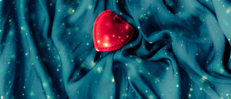 Romance, surprise and holidays concept - Valentines Day abstract background, heart shaped jewellery gift box on silk backdrop, love dating and engagement romantic present, luxury brand holiday designの写真素材