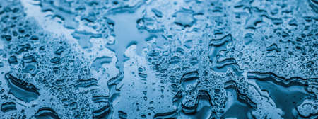 Liquid, wet and zen concept - Water texture abstract background, aqua drops on blue glass as science...
