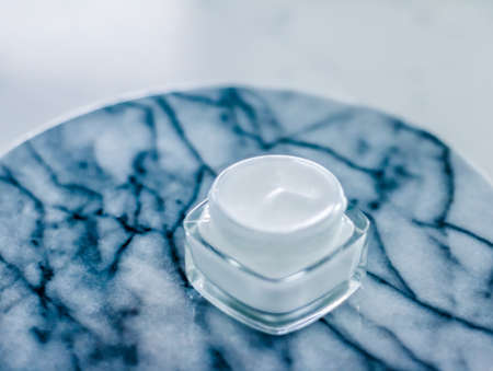 Anti-age product, luxury body care and organic science concept - Moisturizing beauty cream on blue marble stone, skincare and spa cosmeticsの写真素材