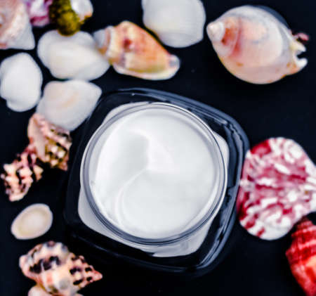 Spa product, organic skin care and natural emulsion concept - Sensitive skincare moisturizer beauty face cream on water and sea shells background, luxury anti-age cosmeticsの写真素材