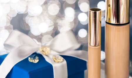 Cosmetic branding, Christmas glitter and girly blog concept - Holiday make-up foundation base, concealer and blue gift box, luxury cosmetics present and blank label products for beauty brand designの写真素材