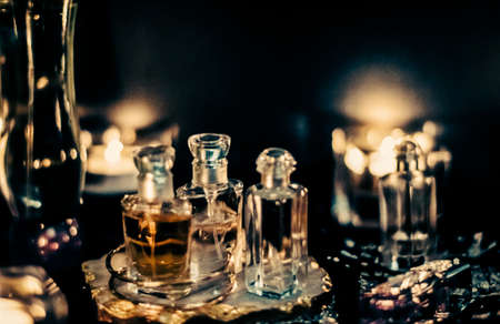 Perfumery, cosmetic branding and spa concept - Perfume bottles and vintage fragrance at night, aroma scent, fragrant cosmetics and eau de toilette as luxury beauty brand, holiday fashion parfum designの写真素材