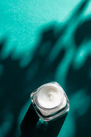 Luxe cosmetics, anti-age moisturizer and organic science concept - Beauty face cream for sensitive skin, moisturizing luxury spa cosmetic and natural complexion skincare product on emerald backgroundの写真素材