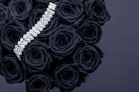 Luxe branding, glamour fashion and boutique shopping concept - Luxury diamond jewelry bracelet and black roses flowers, love gift on Valentines Day and jewellery brand holiday background designの写真素材
