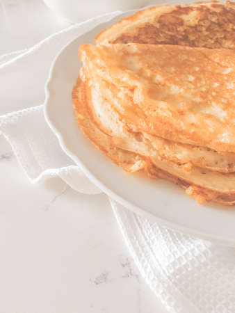Brunch, sweet and diet concept - Authentic food, thin homemade pancakes on marble table background,...