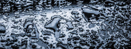 Liquid, wet and zen concept - Water texture abstract background, aqua drops on silver glass as...