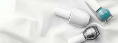 Cosmetic branding, salon and glamour concept - Nail polish bottles on silk background, french manicure products and nailpolish make-up cosmetics for luxury beauty brand and holiday flatlay art designの写真素材